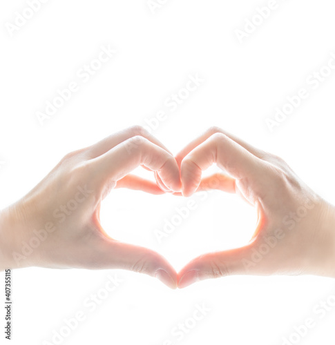 A person's hands express care and love by forming a heart shape with fingers on white background. Symbolic of people's showing emotion on valentine. Isolated hand-sign conceptual.