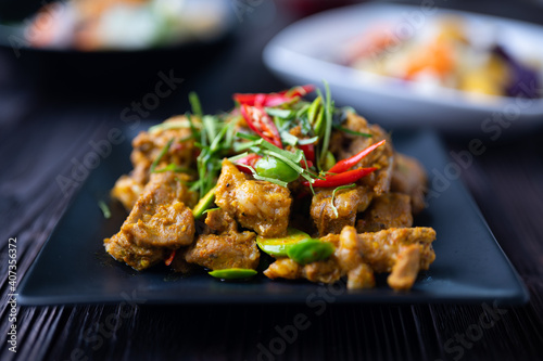 Stir Fried Pork Ribs Red Curry Paste And Coconut Milk.