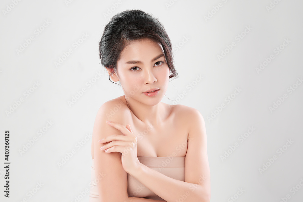 Obraz premium Beautiful young asian woman with clean fresh skin on white background, Face care, Facial treatment, Cosmetology, beauty and spa, Asian women portrait