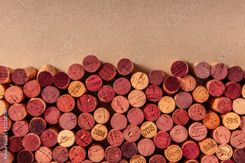 Wine corks background, a design template for a restaurant menu or winery brochure, shot from the top with copy space