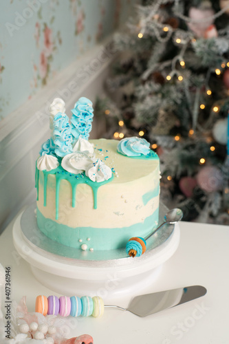 Wedding cake with candles and flowers in blu and wite colors
