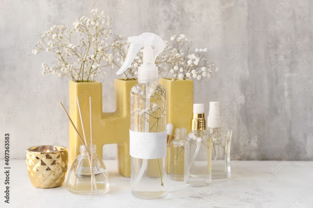 Natural air freshener and essential oil on grey background Natural air freshener and essential oil on grey background