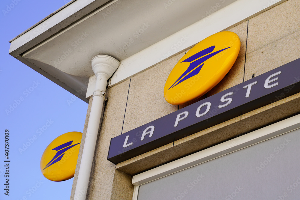 La Poste logo brand and text yellow sign front of agency Post office store  in France Stock Photo | Adobe Stock