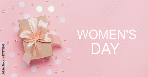 Gifts on pink background, love and valentine concept with text Womens Day © Daria Lukoiko