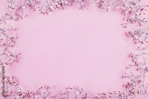Beautiful flower frame of gypsophila flowers. Flat lay, top view. Floral pattern.