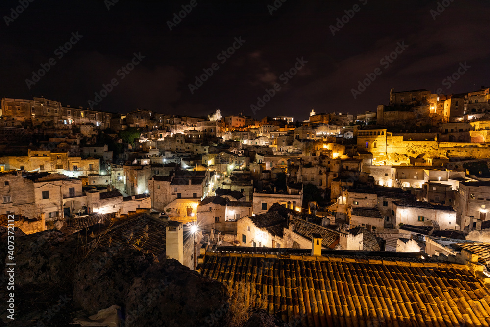 Night landscape of the Sassi of Matera, well-known for their ancient cave dwellings. Basilicata. Italy