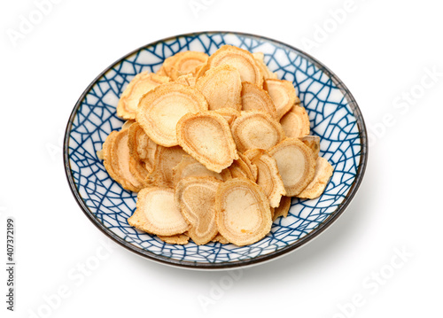 Chinese Herbal medicine - American Ginseng slices  Panax quinquefolius  isolated on white background