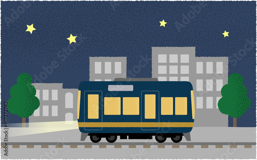 夜、ライトを点けて都市を走る電車のベクターイラスト
