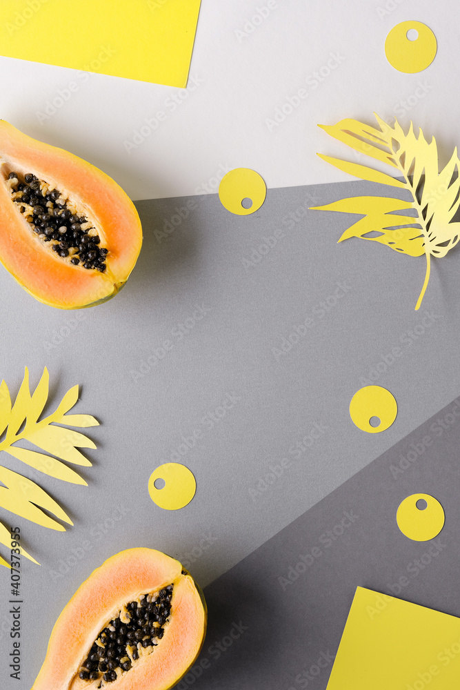 Exotic papaya fruit. Illuminating Yellow and Ultimate Gray, colors of