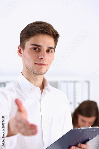 Businessman offer hand to shake as hello closeup isolated on white. Serious business, friendly support service, excellent prospect, introduction or thanks gesture, gratitude, invite to participate