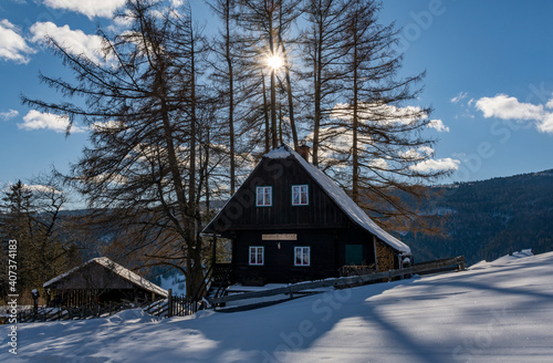Sun above Hirschegger hut, Hirschegg, Austria, in winter