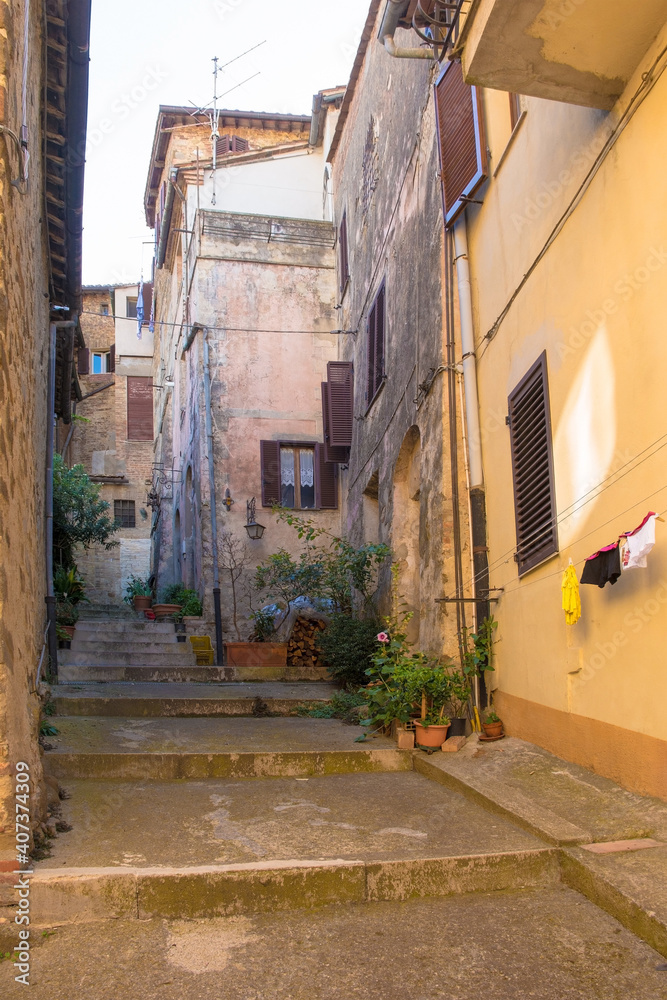 Fototapeta premium A quiet residential street in the historic medieval village of Montalcino in Siena province, Tuscany, Italy 