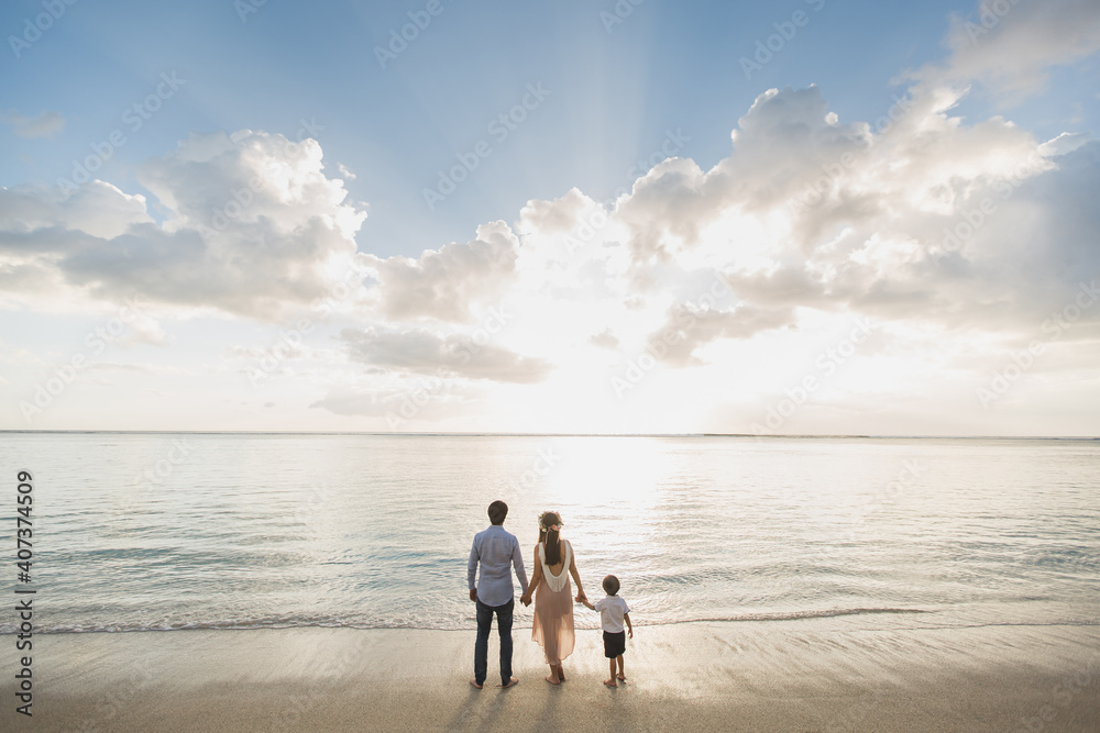 Pregnant mother father and son on the beach, delighted the sunset. Pregnant mother father and son on the beach, delighted the sunset.