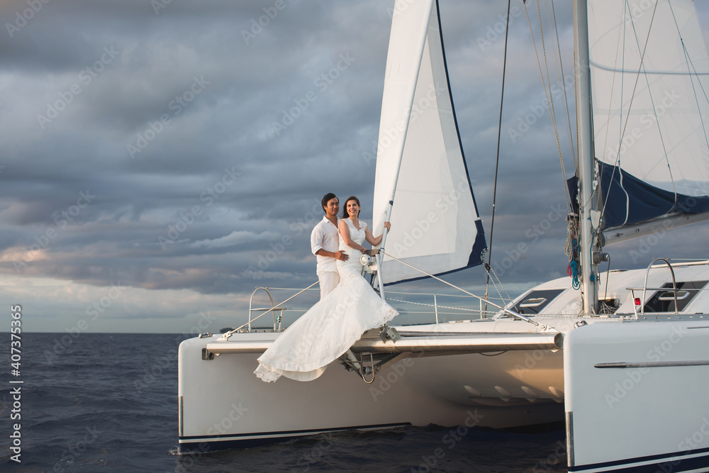 Wedding couple is hugging on a yacht. Beauty bride with groom. Wedding couple is hugging on a yacht. Beauty bride with groom.