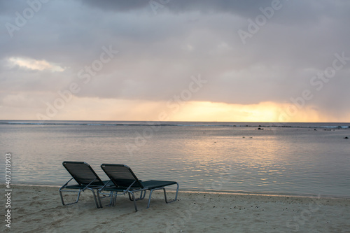 beach chair on the beach with sunset © Artem Zakharov
