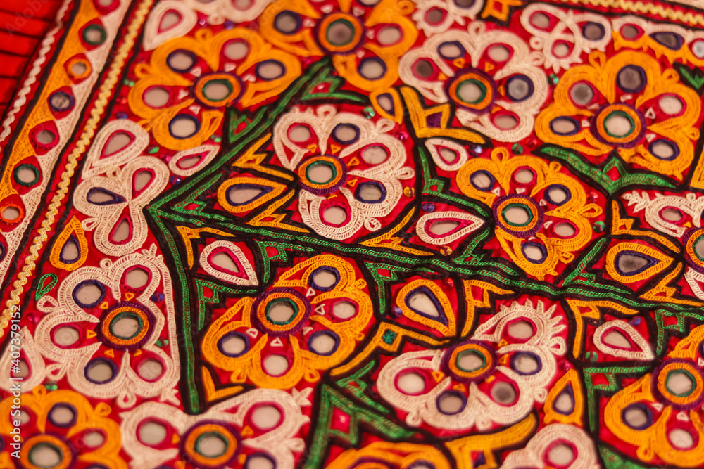 Mirrored embroidery work typical of the Aahir tribe,unidentified man embroidering cloth in traditional method of India,mirror work colorful handmade ahir bharat,Kutch-gujarat