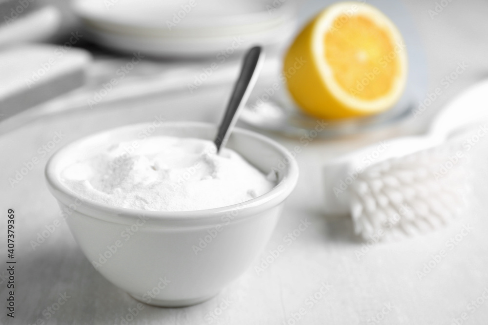 Bowl of baking soda on white table, space for text Bowl of baking soda on white table, space for text