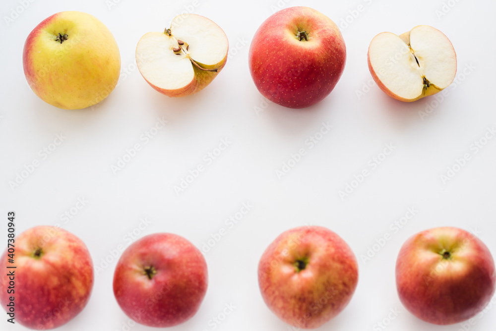 red apples on white background, halves of apples on a white background red apples on white background, halves of apples on a white background