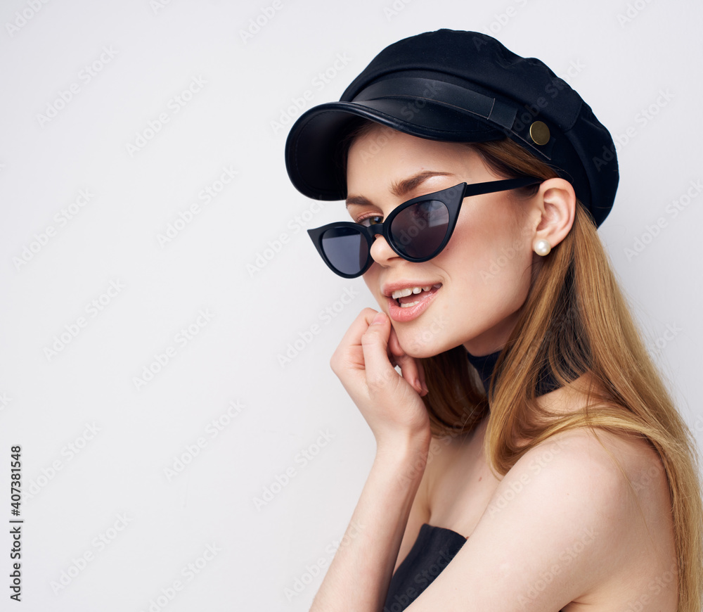 Elegant woman in sunglasses black cap jewelry accessories close-up Elegant woman in sunglasses black cap jewelry accessories close-up