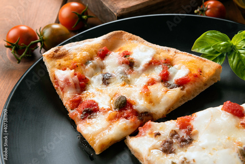 Fette di pinsa romana, variante della pizza italiana  photo