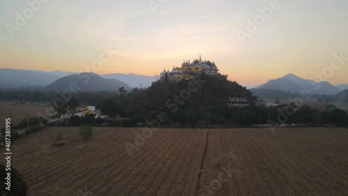 Landscape of Wat Simalai Songtham on the mountain at sunset and twilight at Pak Chong, Nakhon Ratchasima, Thailand. photo