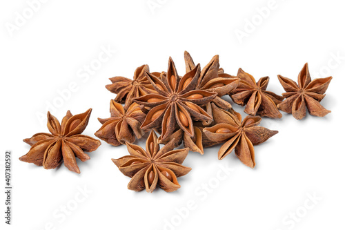 Heap of dried star anise close up on white background