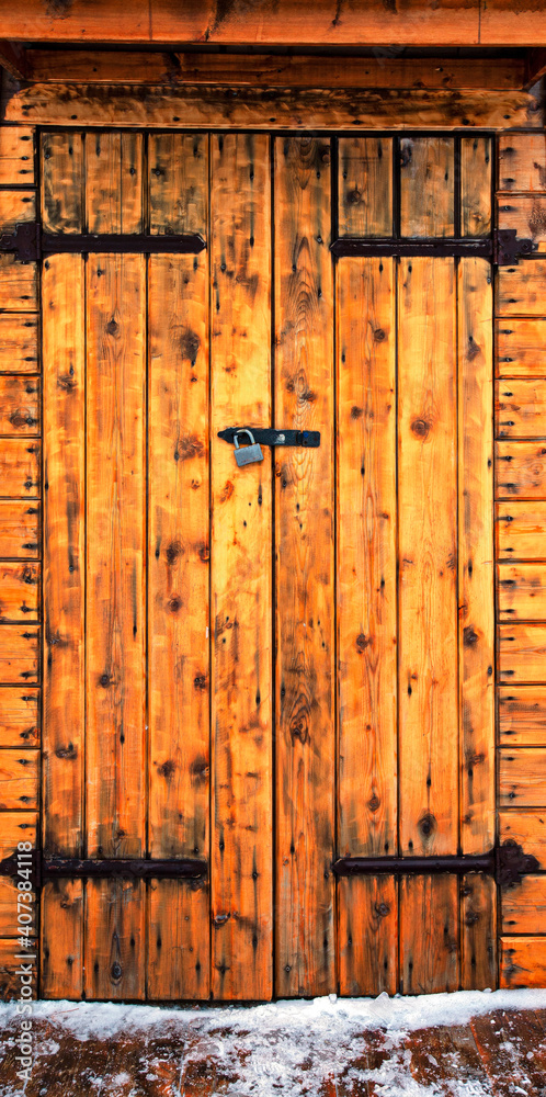 vintage wooden door with lock in winter.Selective focus