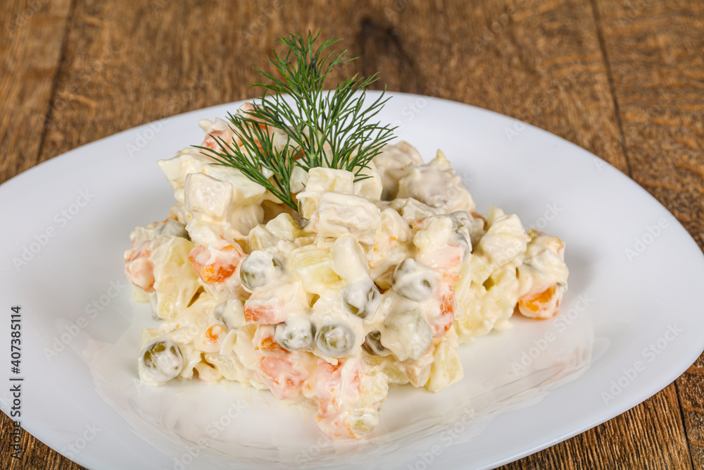 Traditional Russian salad with mayonnaise Traditional Russian salad with mayonnaise