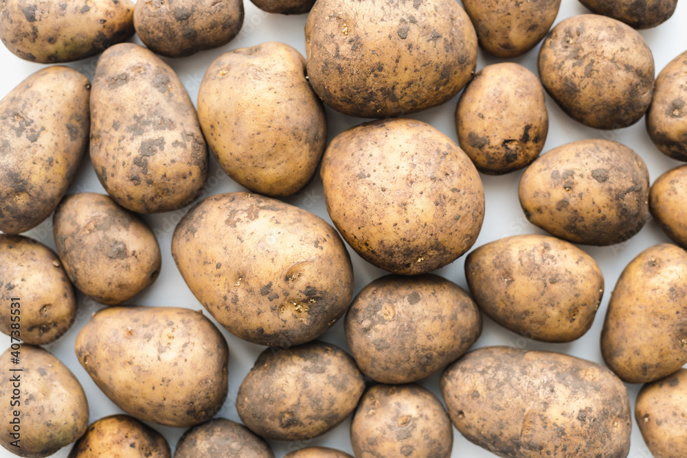 potatoes on white background, dirty potatoes, a bunch of potatoes potatoes on white background, dirty potatoes, a bunch of potatoes