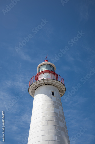 White lighthouse on bright summer day