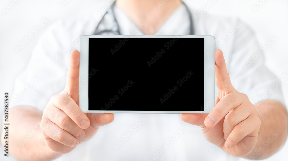 Tablet in doctor's hands on white background Tablet in doctor's hands on white background