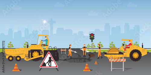 Workers change the asphalt, repair the road surface.