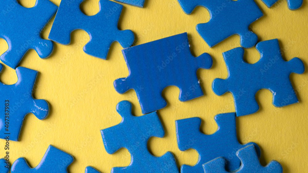 scattered puzzle pieces on colored background