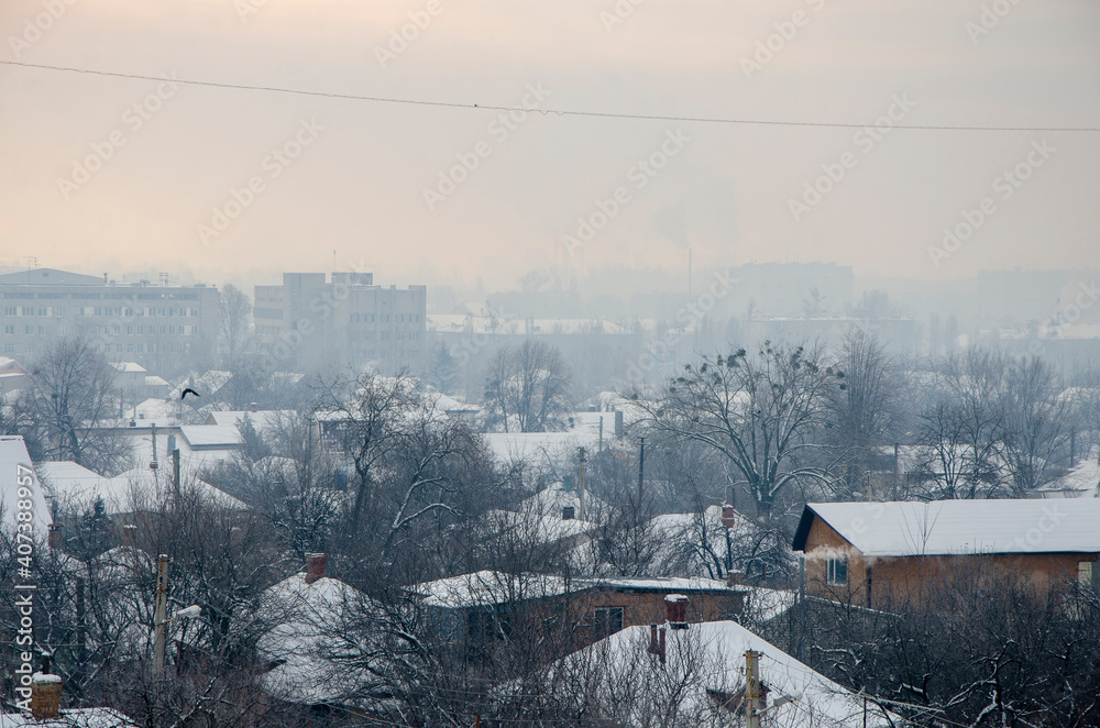 Landscape top view on winter snowy village town in frost and sun