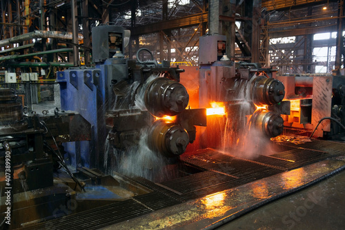 hot steel on conveyor in a steel mill. hot rolled rebar