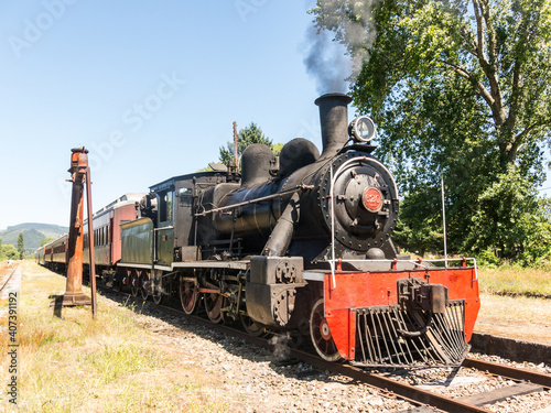 Tourist train called Valdiviano that runs from Valdivia to Antilhue with a 1913 North British locomotive type 57. Los Rios Region, in southern Chile.