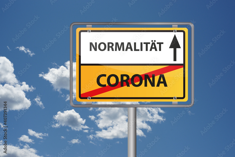 Corona Virus Pandemie vorbei, endlich wieder Normalität - Ortsausgangsschild vor blauem Himmel Corona Virus Pandemie vorbei, endlich wieder Normalität - Ortsausgangsschild vor blauem Himmel