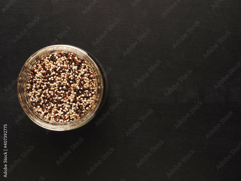 Organic quinoa in a jar on a board with space for your text Organic quinoa in a jar on a board with space for your text