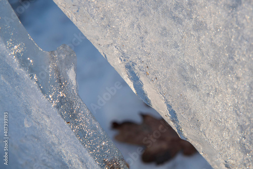 .Close-up pieces of ice texture on the forest in winter time at Bucharest.. photo