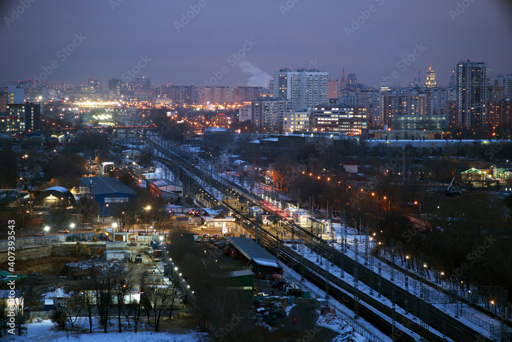 Moscow, Russia. Desember 23 2020: Trains and the Moscow skyline. Ostankino railway platform.