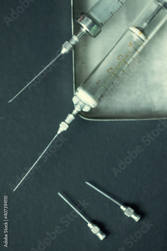 Old reusable glass syringes with needles