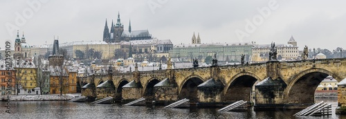 Historical center of Prague covered in the first snow of the winter.