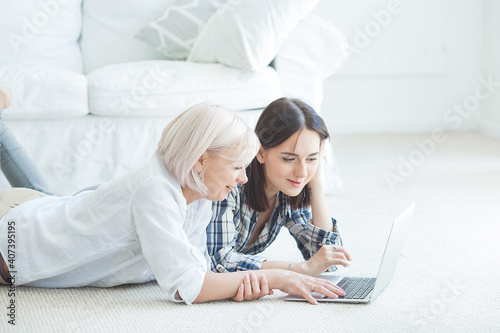 Murais de parede Women browsing at laptop. Female typing on computer