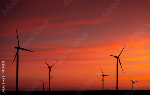 Field of windmill during a beautiful sunset source of green energy great for the environment