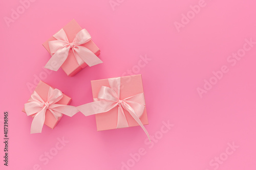 Valentines day composition  three pink gift boxes with ribbon