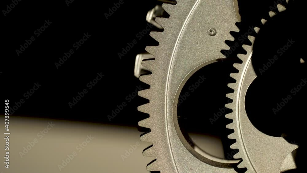 Close up cogwheels of an industrial looking clock Close up cogwheels of an industrial looking clock