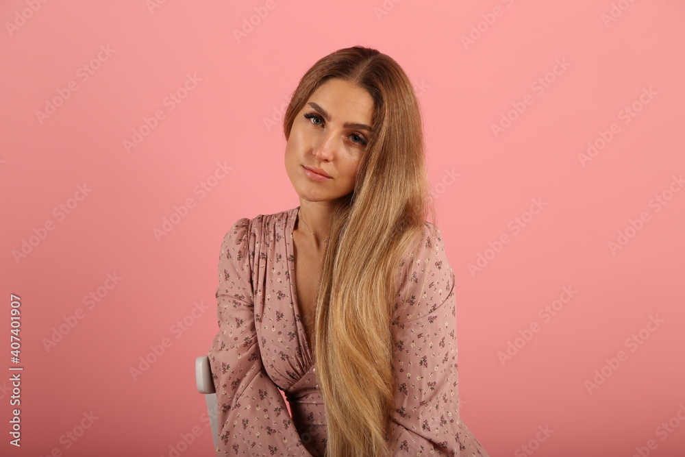 Young woman in dress on pink background Young woman in dress on pink background