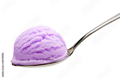 Blueberry or purple ice cream scoop in spoon isolated on white background including clipping path.