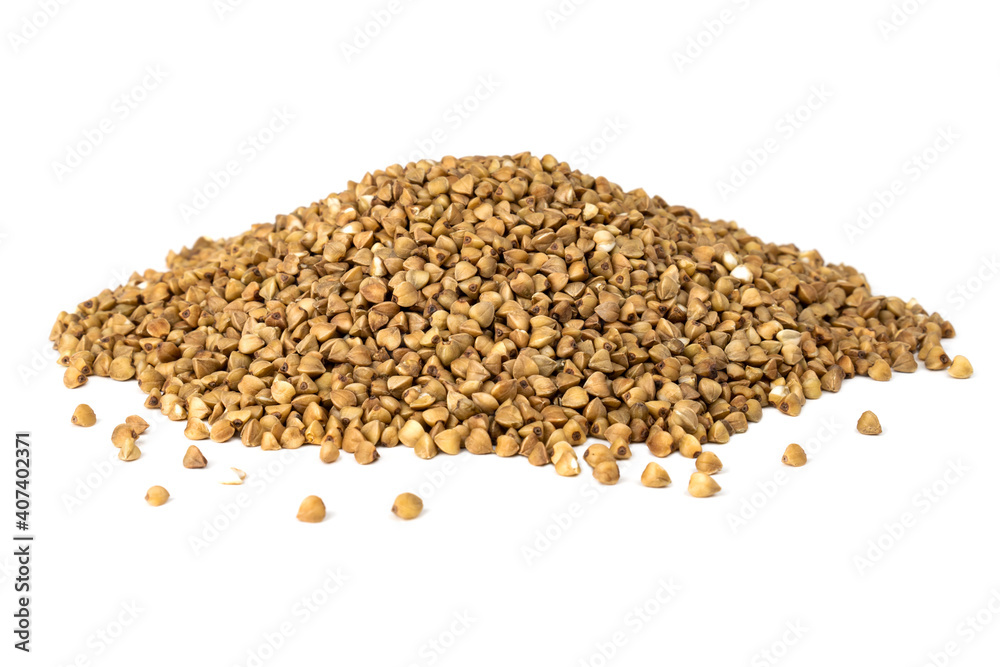 Heap of dry buckwheat groats isolated on white background. Heap of dry buckwheat groats isolated on white background.