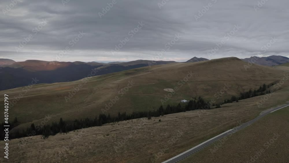 4K Aerial view of a beautiful sunrise over Transbucegi curved road in the mountains of Romania 4K Aerial view of a beautiful sunrise over Transbucegi curved road in the mountains of Romania